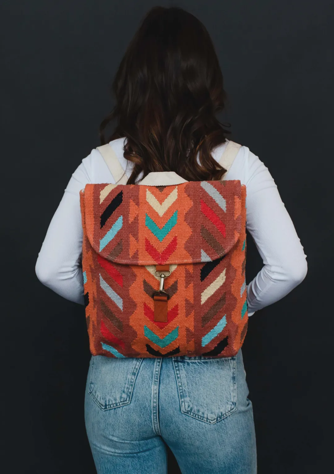 orange multi woven backpack